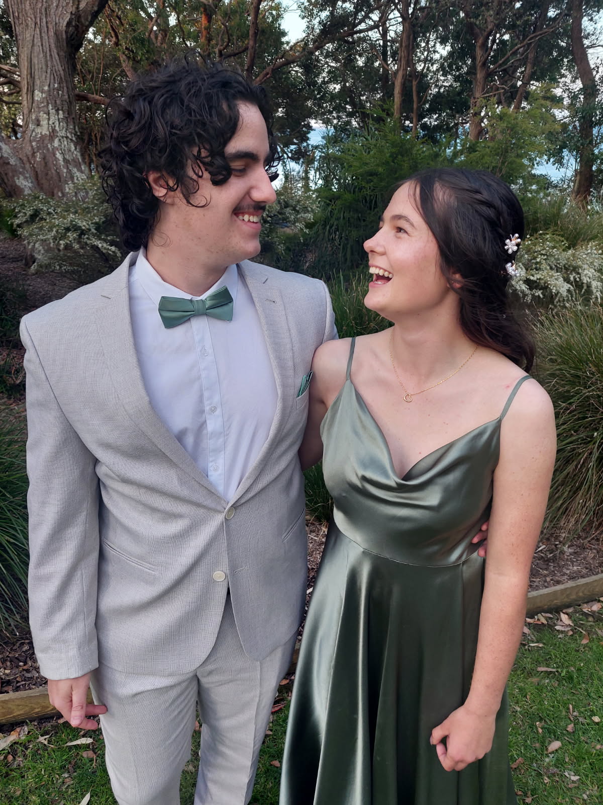 Grey groomsman suit with green bow tie after formalwear tailoring on the NSW South Coast