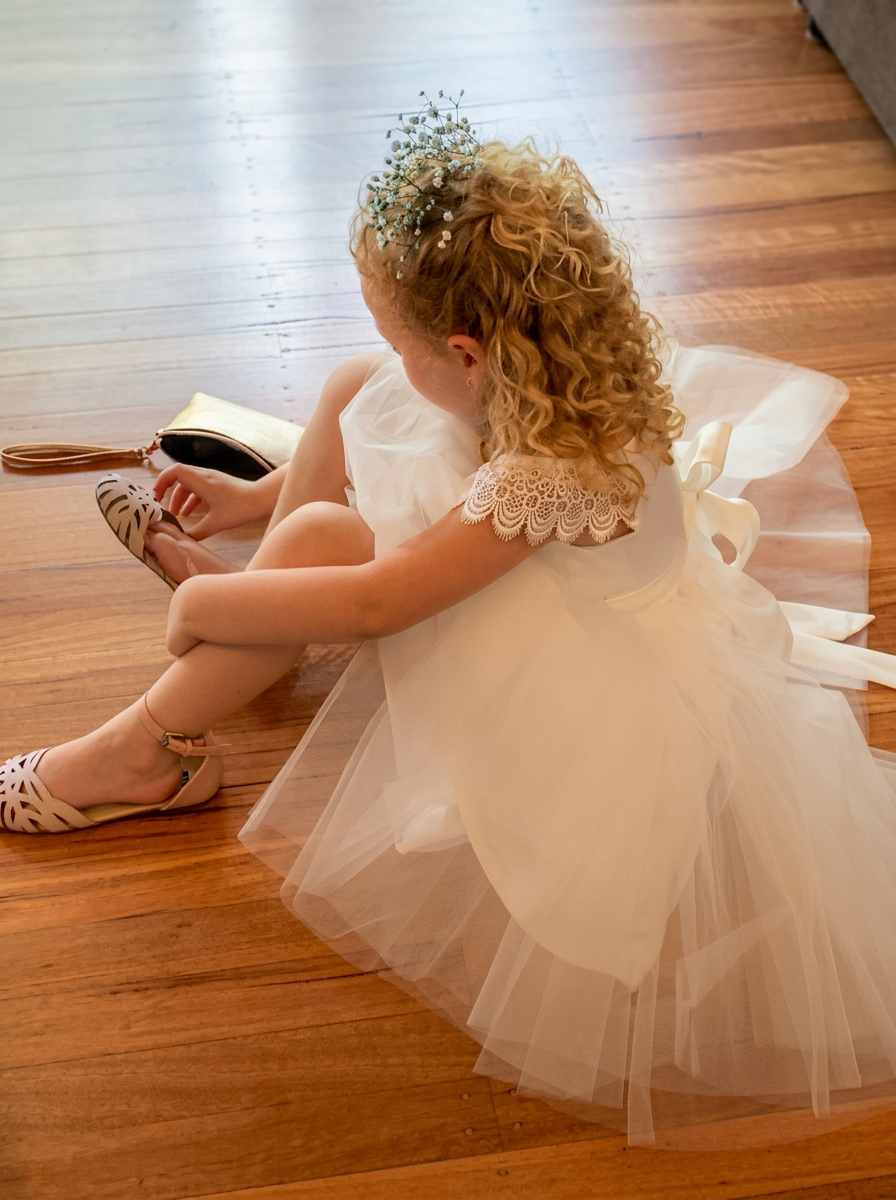 Flower girl in tulle dress with baby's breath — flower girl dress alterations by Jacqui, Shoalhaven Heads NSW