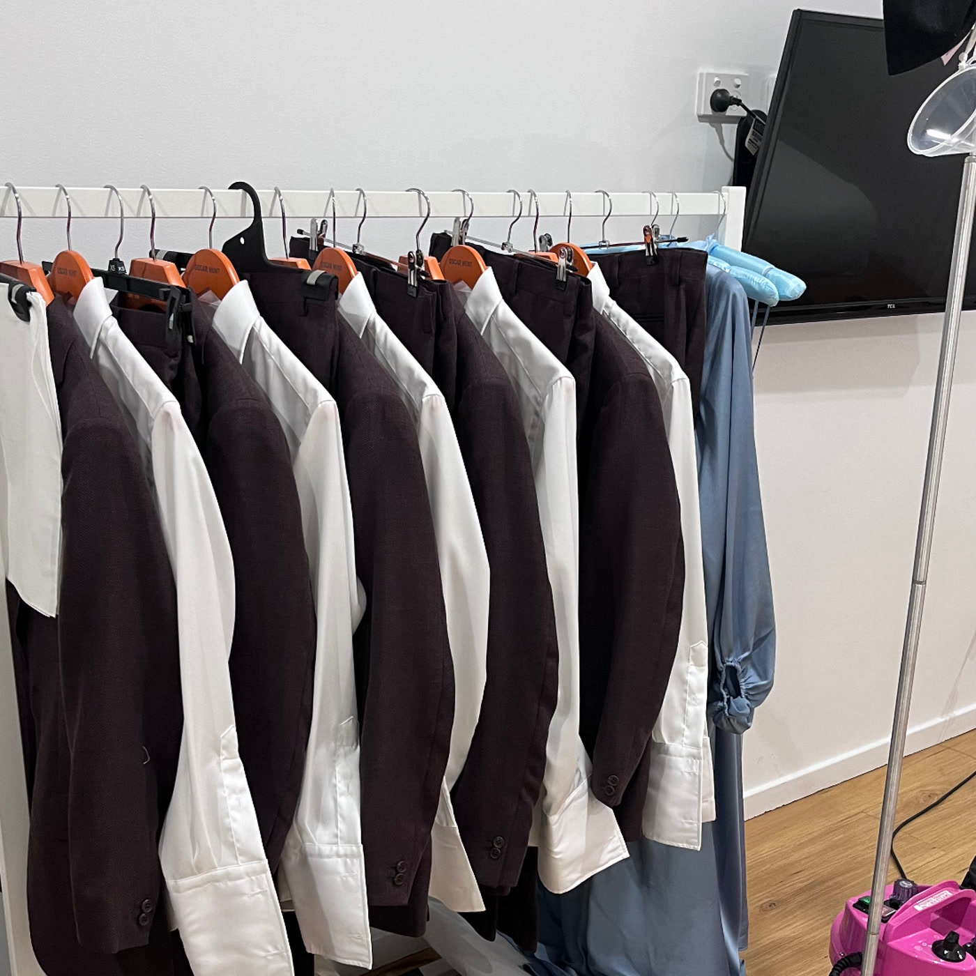 On-site wedding day steaming setup with suits, shirts and garment rack — Jacqui's mobile steaming service NSW