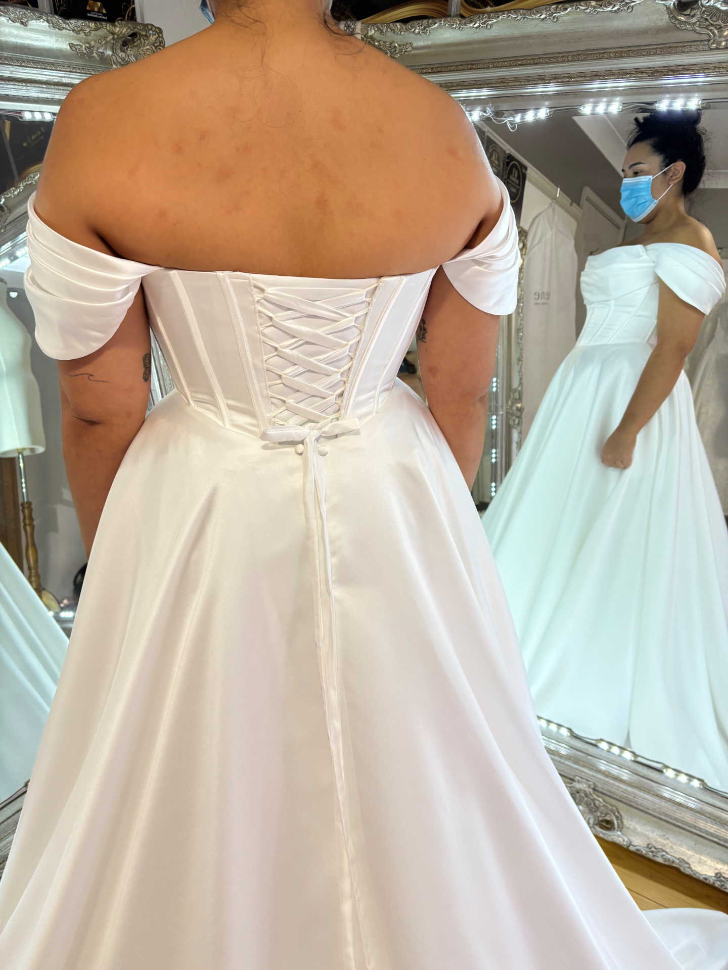 Reconstructed wedding dress with custom corset lace-up back added by Jacqui — off-shoulder ivory satin ball gown bridal alteration