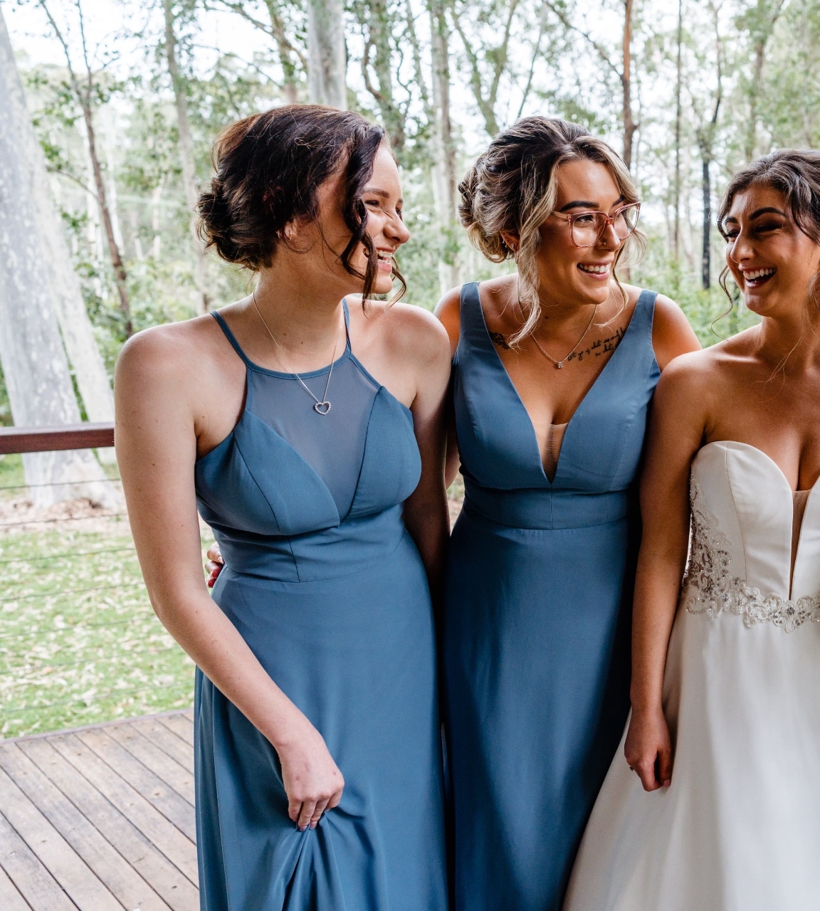 Bridesmaids in dusty blue gowns fitted at Jacqui's Shoalhaven Heads bridal studio